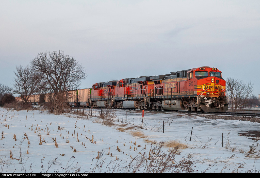 BNSF 5713 GE AC44CW and BNSF 5926 GE ES44AC and sister unit work a westbound empty hopper train